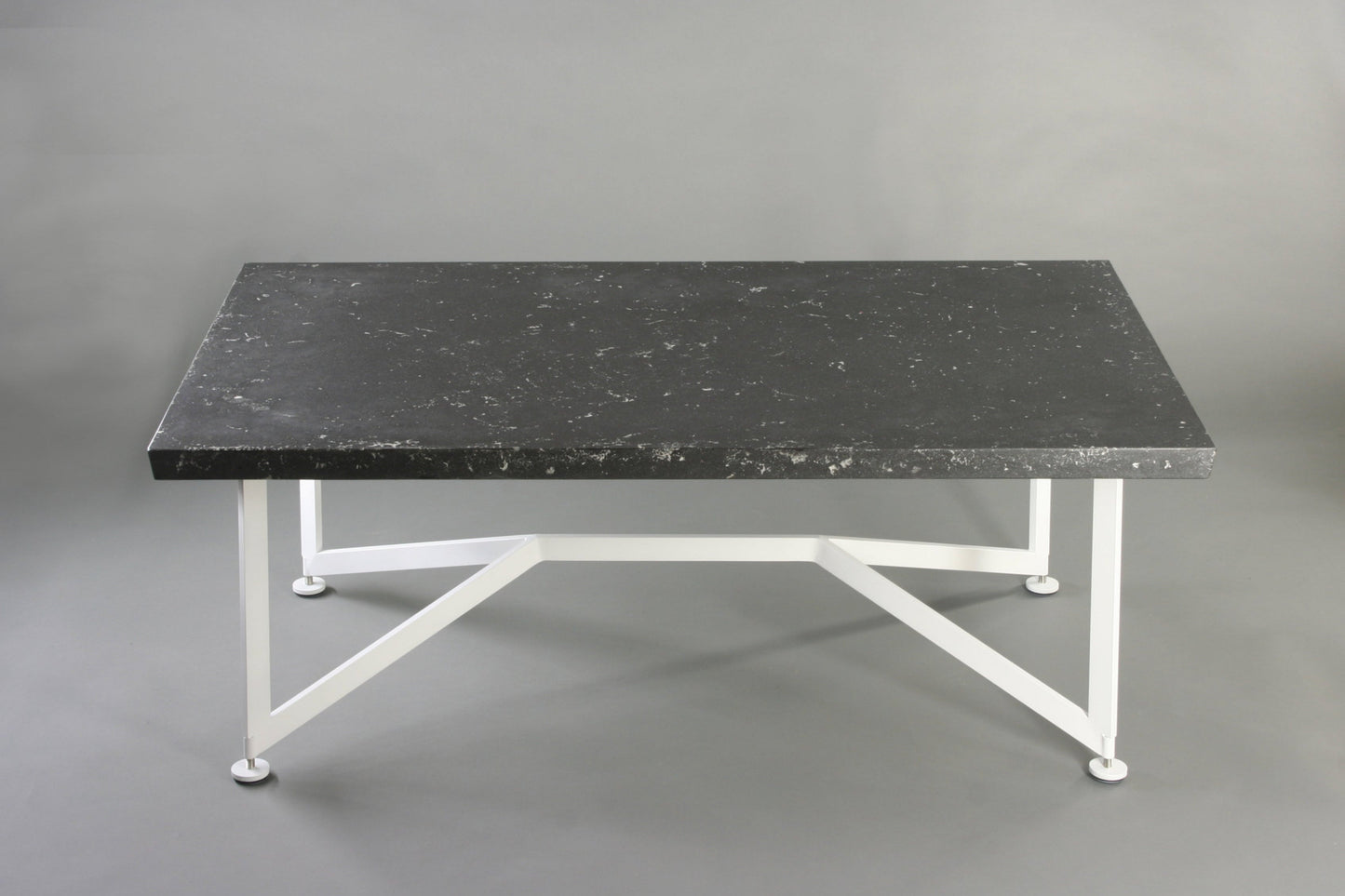 Bevel Coffee Table - Black top/White legs, side view